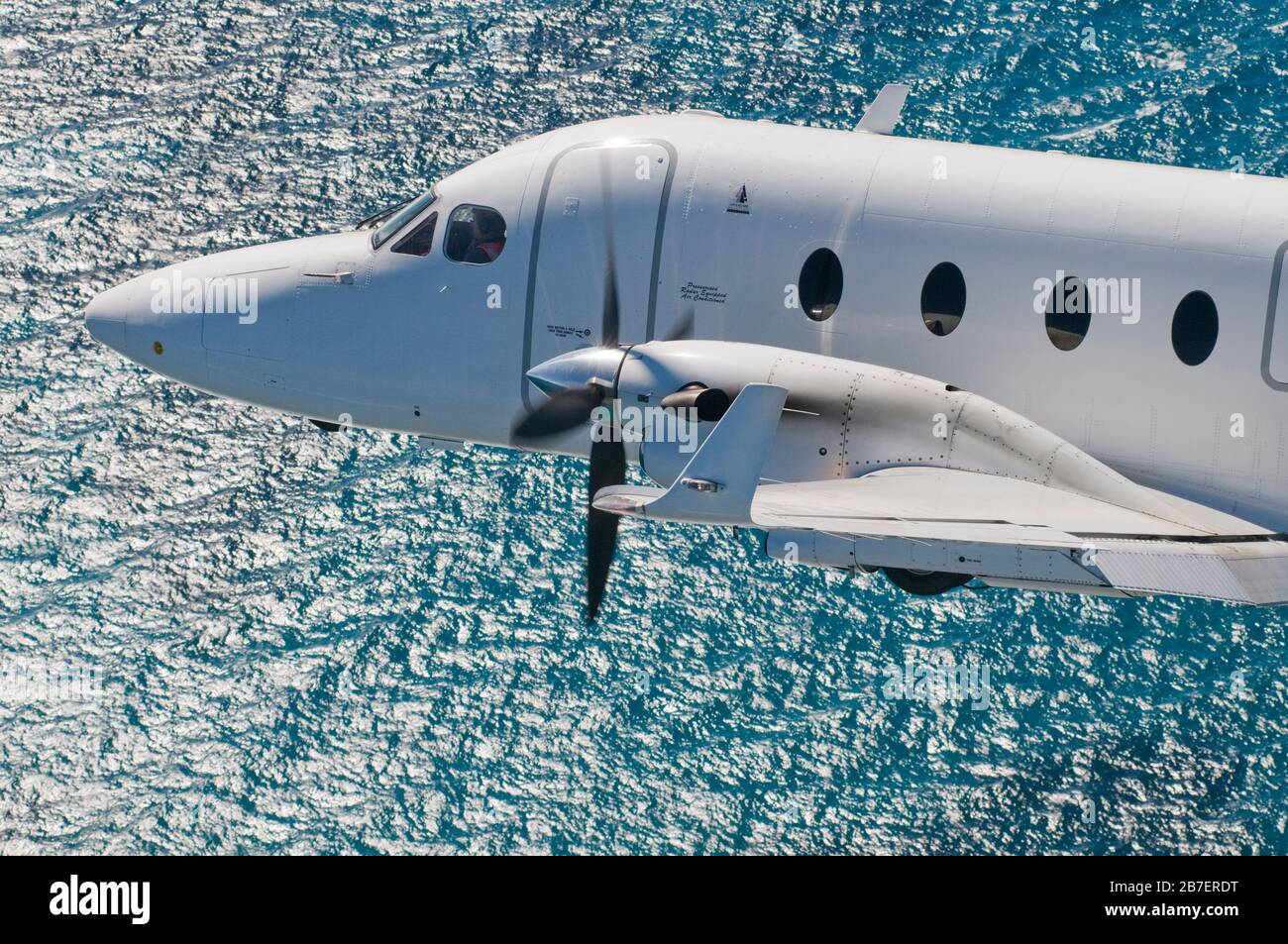 A close up of the propellors of a Raytheon Beechcraft B1900D short haul, fly-in-fly-out charter airliner on the ground. Stock Photo