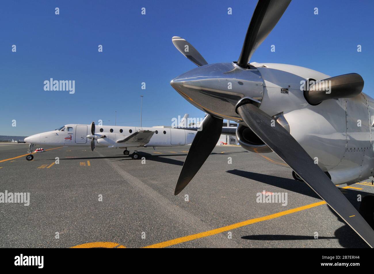 A close up of the propellors of a Raytheon Beechcraft B1900D short haul, fly-in-fly-out charter airliner on the ground. Stock Photo