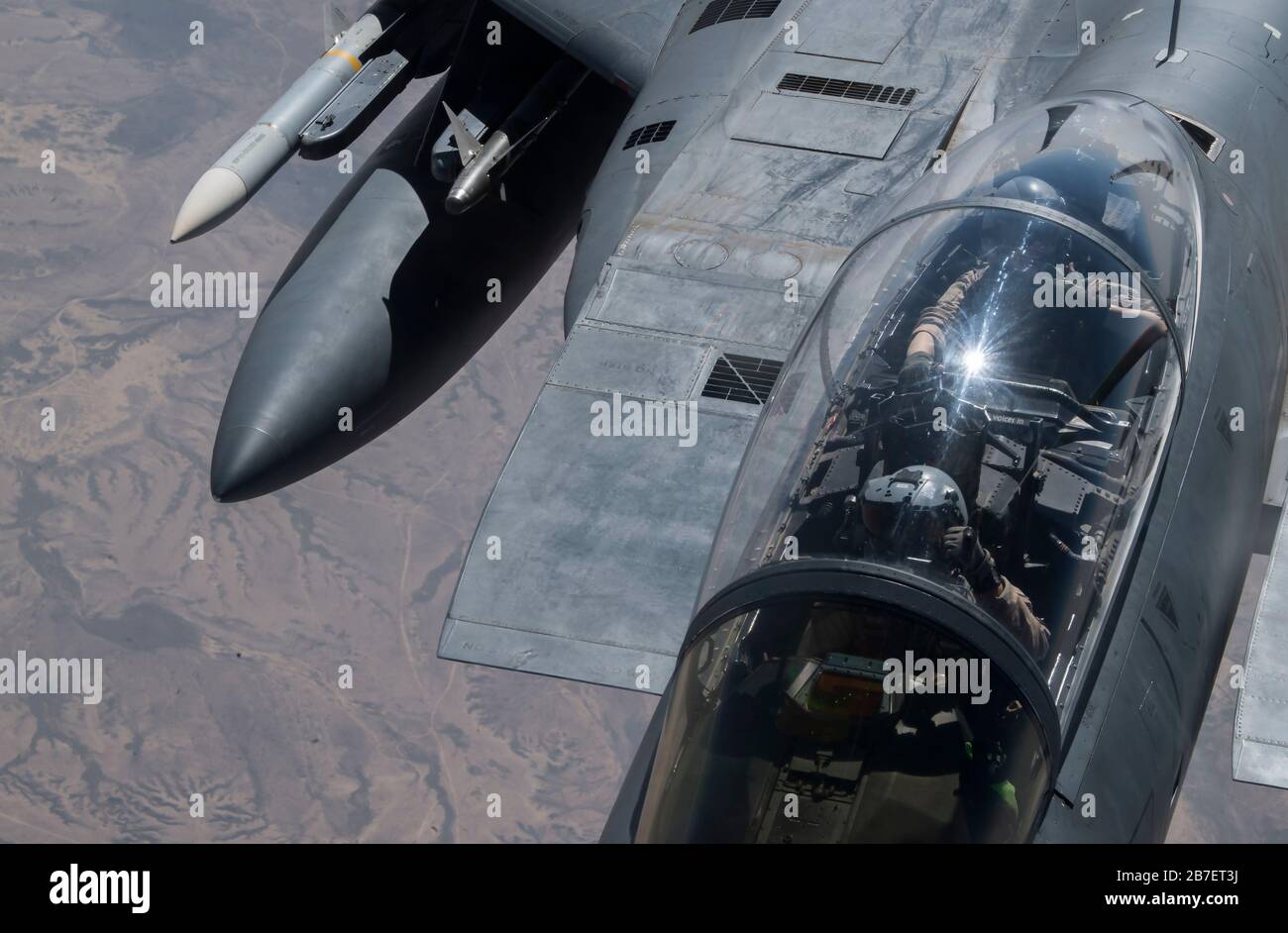 A U.S. Air Force F-15E Strike Eagle receives fuel from a U.S. Air Force KC-135 Stratotanker assigned to the 28th Expeditionary Air Refueling Squadron, over Iraq, March 11, 2020. The F-15E is a dual-role fighter designed to perform air-to-air and air-to-air ground missions, demonstrating U.S. Air Forces Central Commands' posture to compete, deter, and win against state and non-state actors. (U.S. Air Force photo by Tech. Sgt. Matthew Lotz) Stock Photo