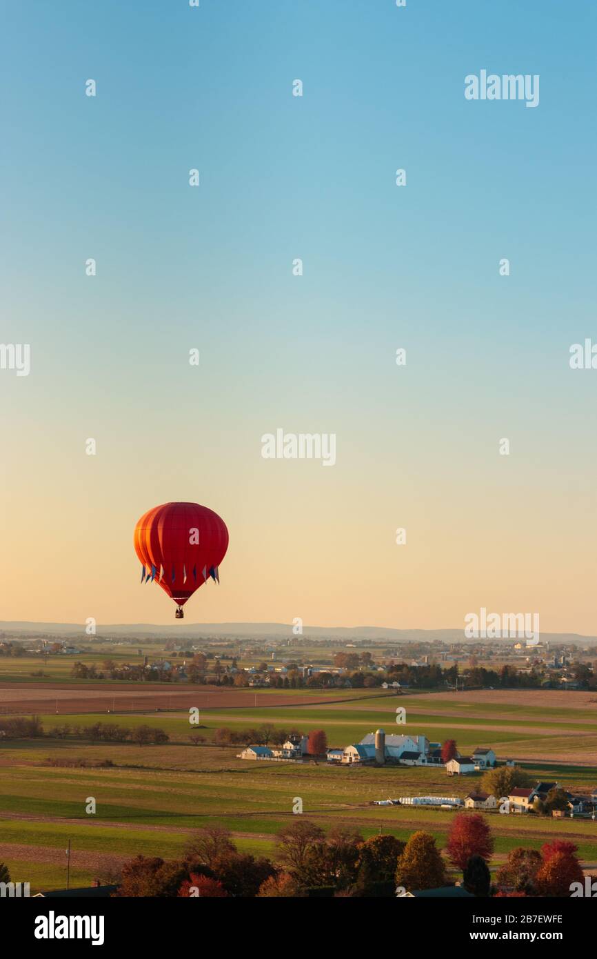 Single hot air balloon in a bright blue sky before dusk Stock Photo - Alamy
