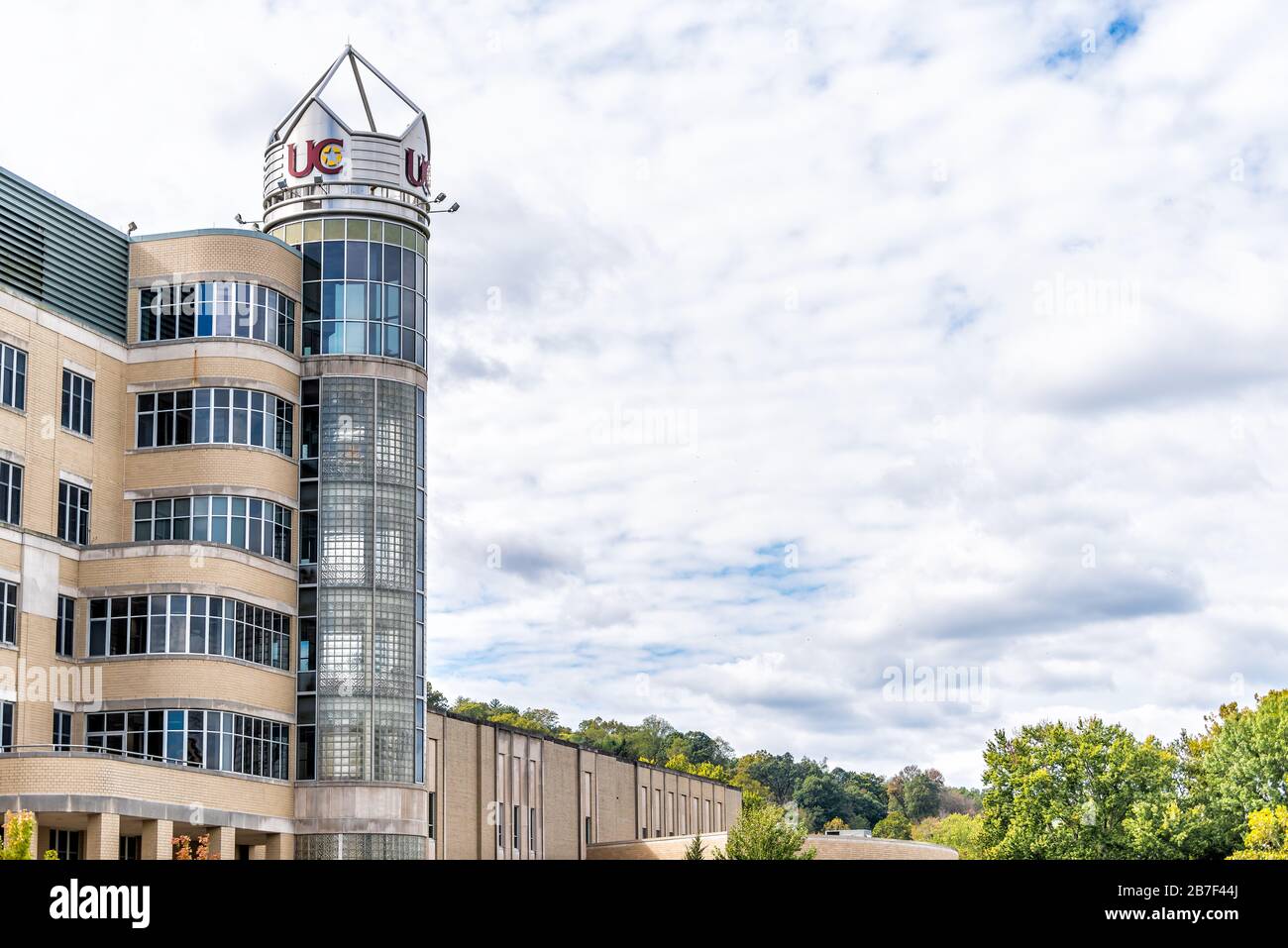 Charleston, USA - October 17, 2019: University campus in West Virginia capital city with UC sign on modern private building and sky Stock Photo