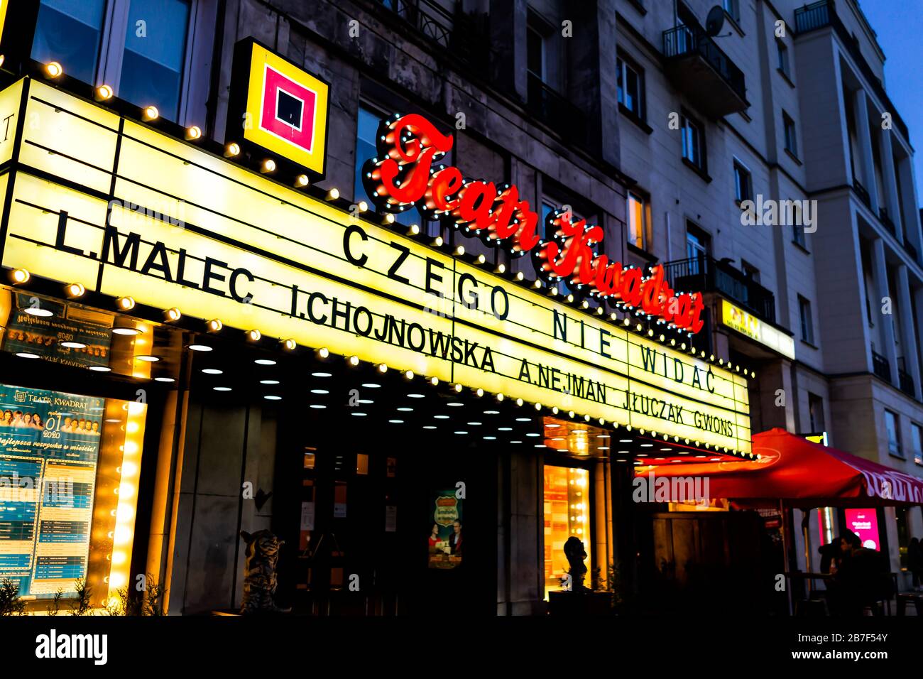 Warsaw, Poland - December 19, 2019: Neon illuminated sign for Teatr Kwadrat or Theater Square sign in Polish outside at Marszalkowska street in Warsza Stock Photo