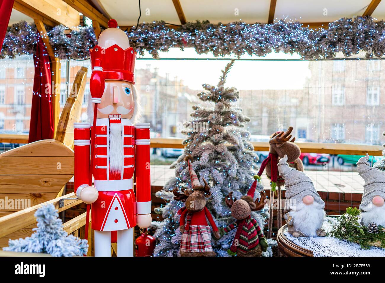 Warsaw, Poland - December 19, 2019: Christmas market in Warszawa old town with photo booth with New Year tree illumination decorations, gnome dwarf an Stock Photo