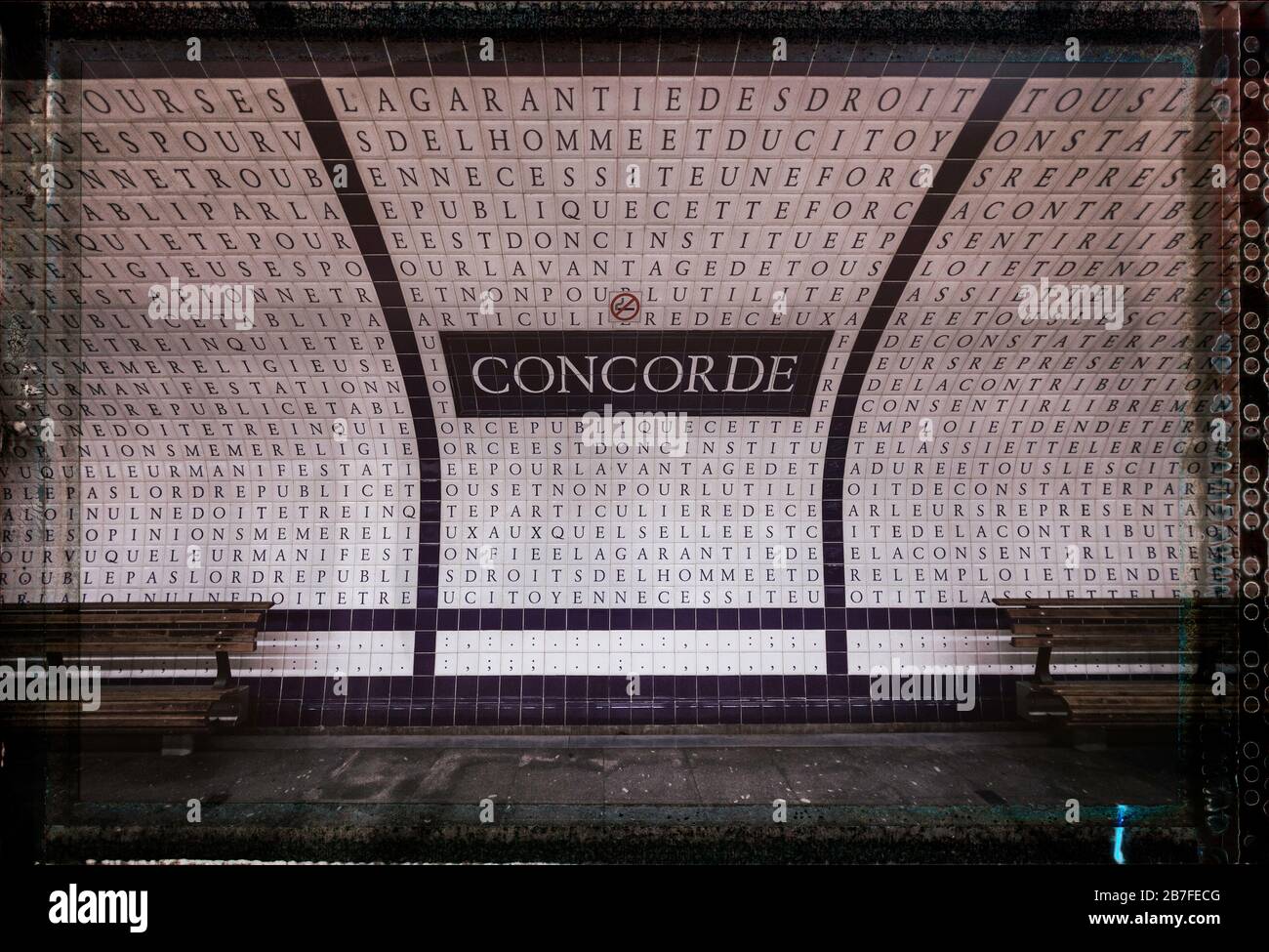 Empty benches platform at Concorde Metro station, where ceramic tiles of letters line walls and ceiling, Right Bank, Paris, France, Europe, color Stock Photo