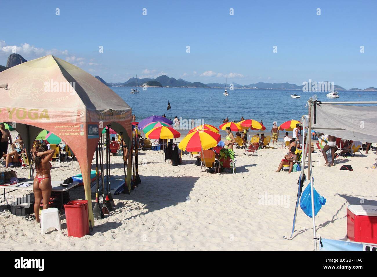 Rio De Janeiro, Rio de Janeiro, Brasil. 15th Mar, 2020. (INT).Movement at the beaches in Rio de Janeiro.March 15, 2020, Rio de Janeiro, Brazil:Movement of people at Copacabana and Ipanema beaches in Rio de Janeiro.Even with the decree banning agglomerations in the state of Rio de Janeiro because of the Corona Virus, beaches still get filled up and do not change the life of Cariocas, this Sunday afternoon (15).(Carioca is name given to someone from Rio de Janeiro).Credit:Fausta Maia/Thenews2 Credit: Fausto Maia/TheNEWS2/ZUMA Wire/Alamy Live News Stock Photo