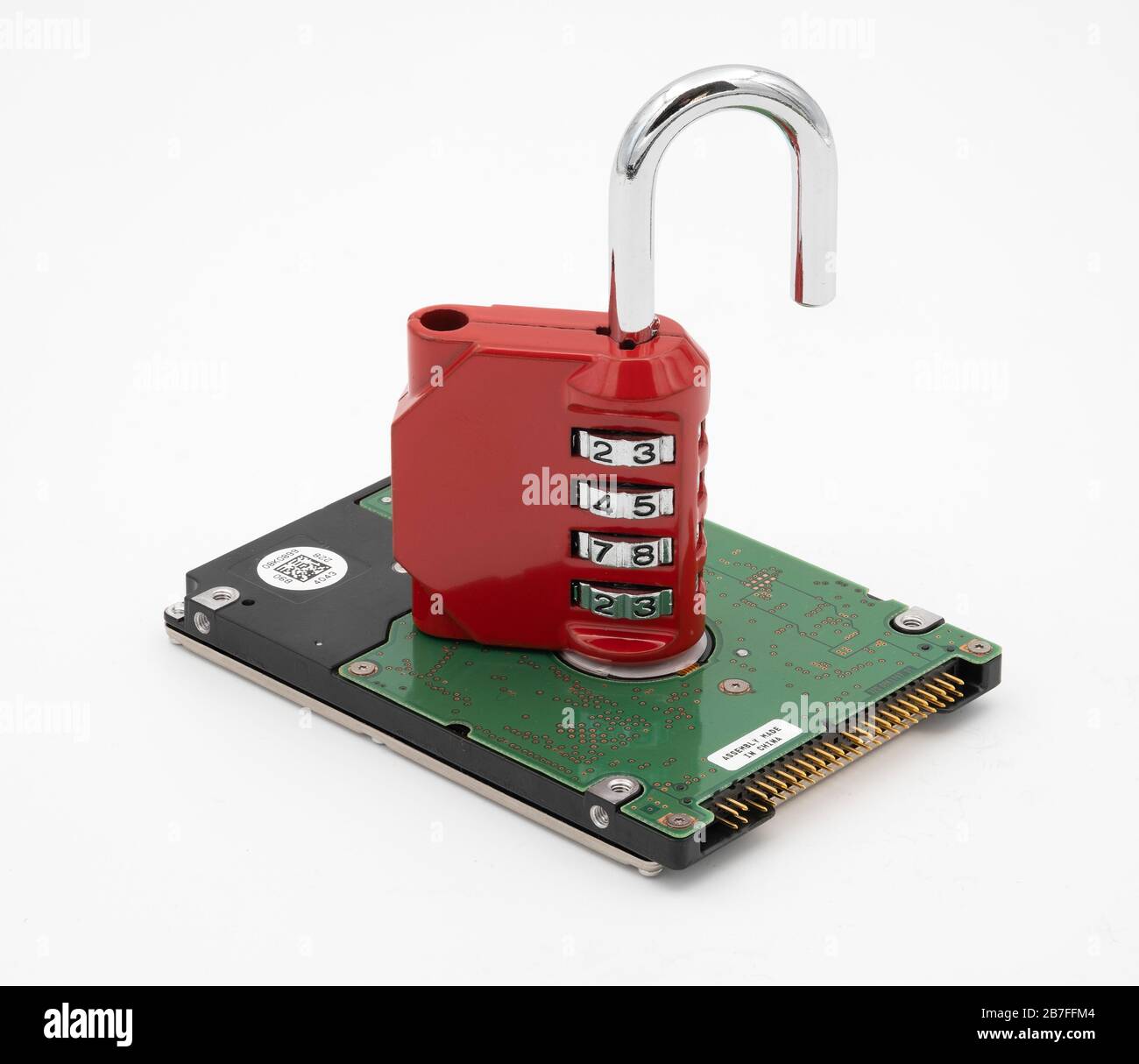 Padlock on top of hard disk drive representing data protection and security Stock Photo