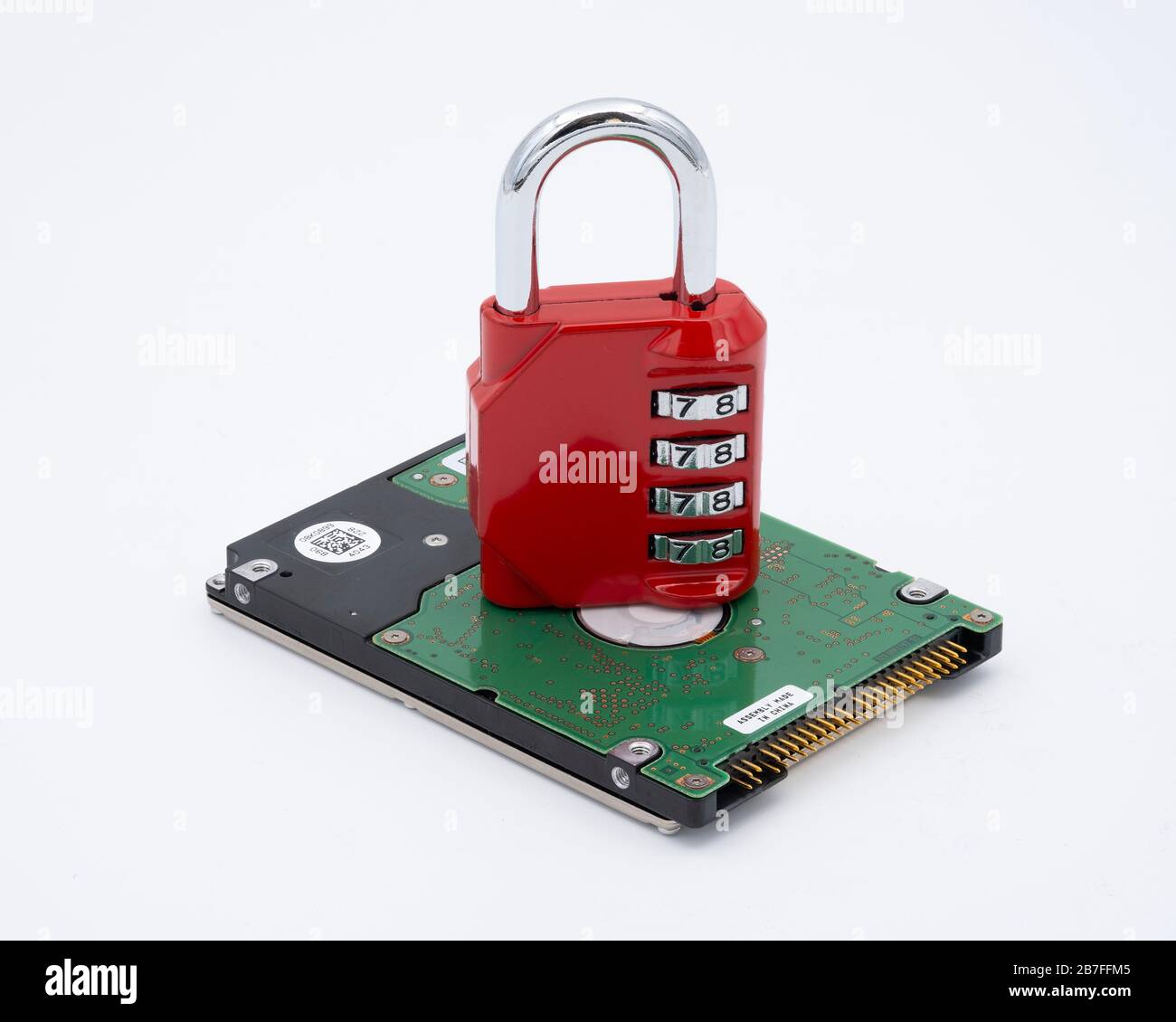 Padlock on top of hard disk drive representing data protection and security Stock Photo