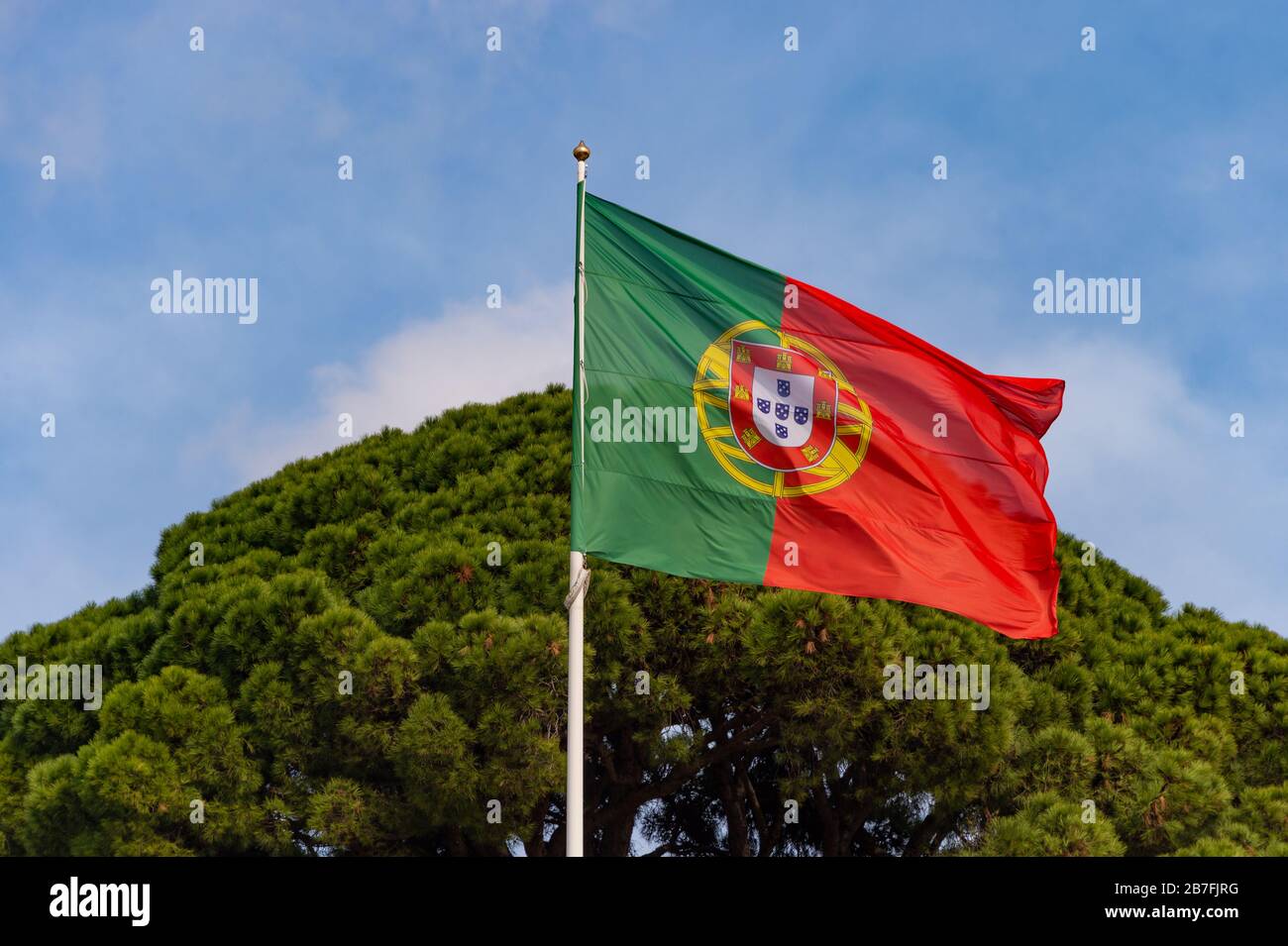 Portuguese flag waving in the wind in Lisbon, Portugal Stock Photo