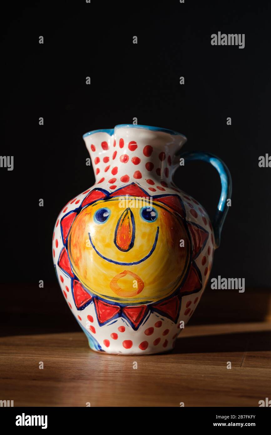 Ceramic beautiful painted vase with handle and sun motive on Stock