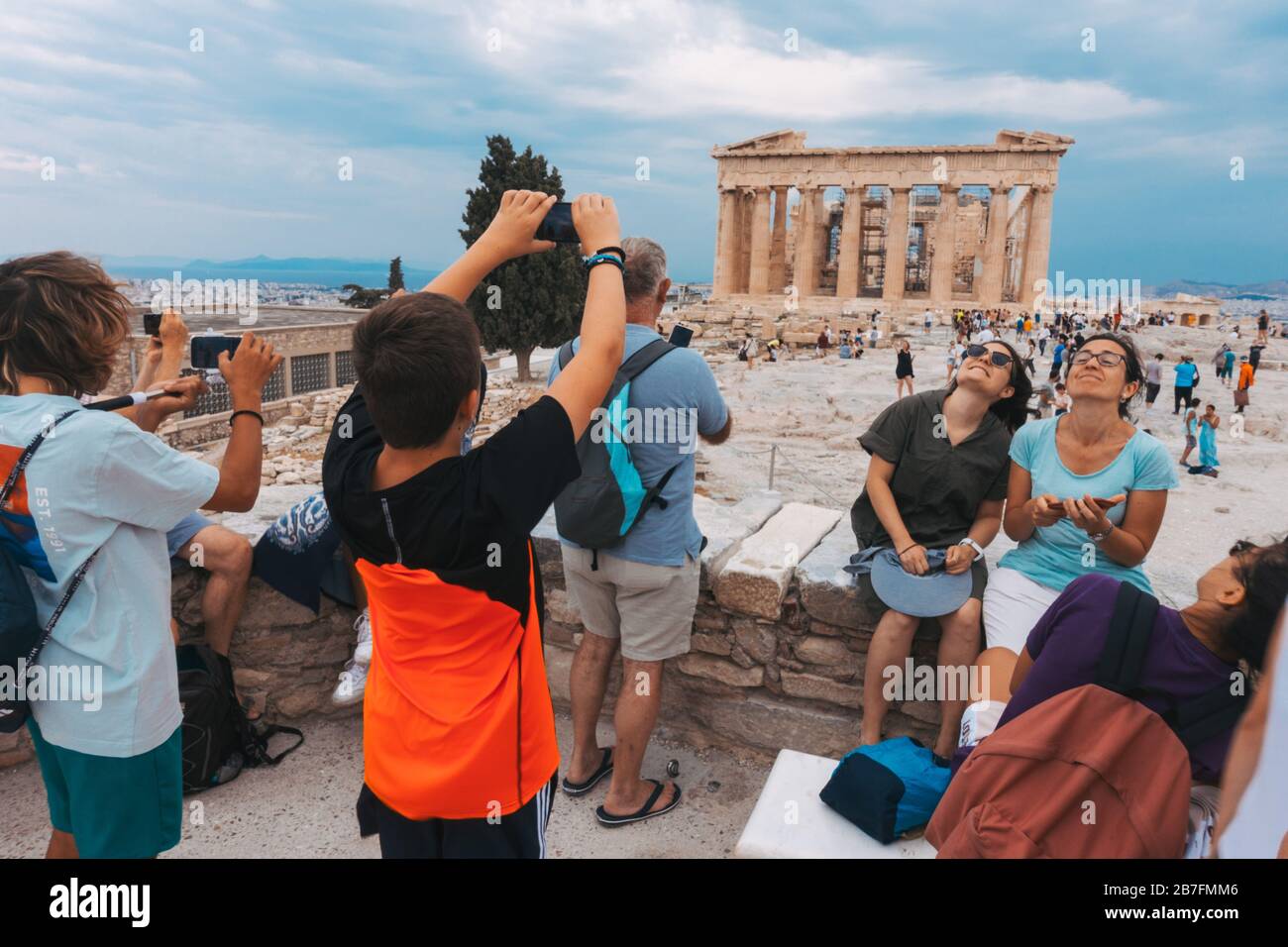 Tourists take selfies and photos at The Acropolis of Athens, Greece Stock Photo
