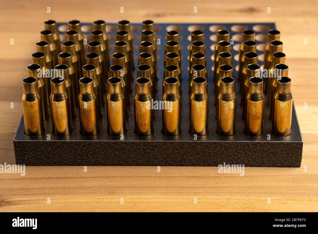 Production of cartridges for a rifle, reload. Many empty shells in the