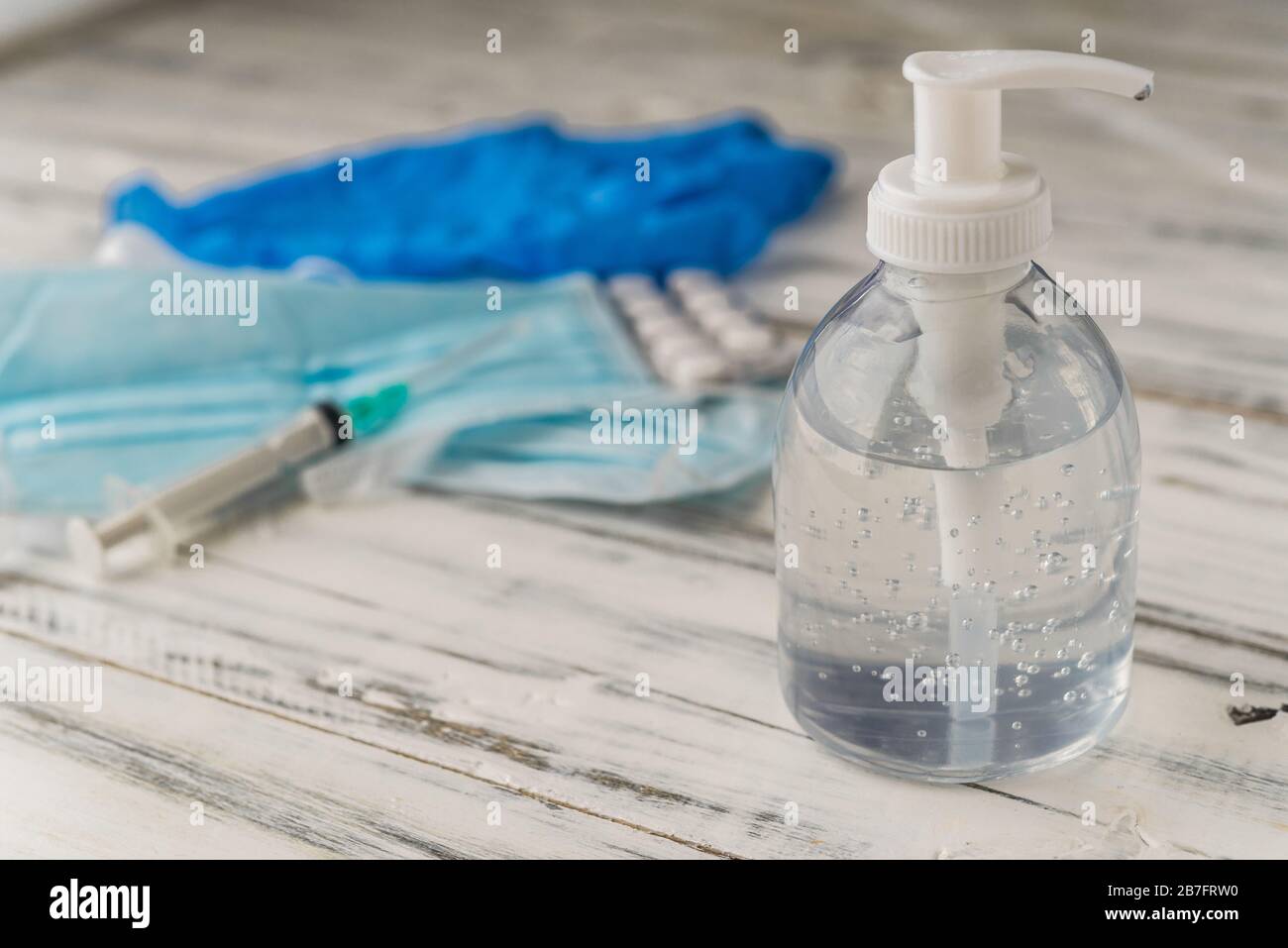Hand sanitizer with disinfectant, face masks, and drugs against coronavirus. Stock Photo