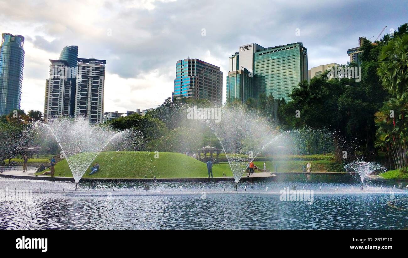 Cityscape of Kuala Lumpur. Beautiful green central park with fountains ...