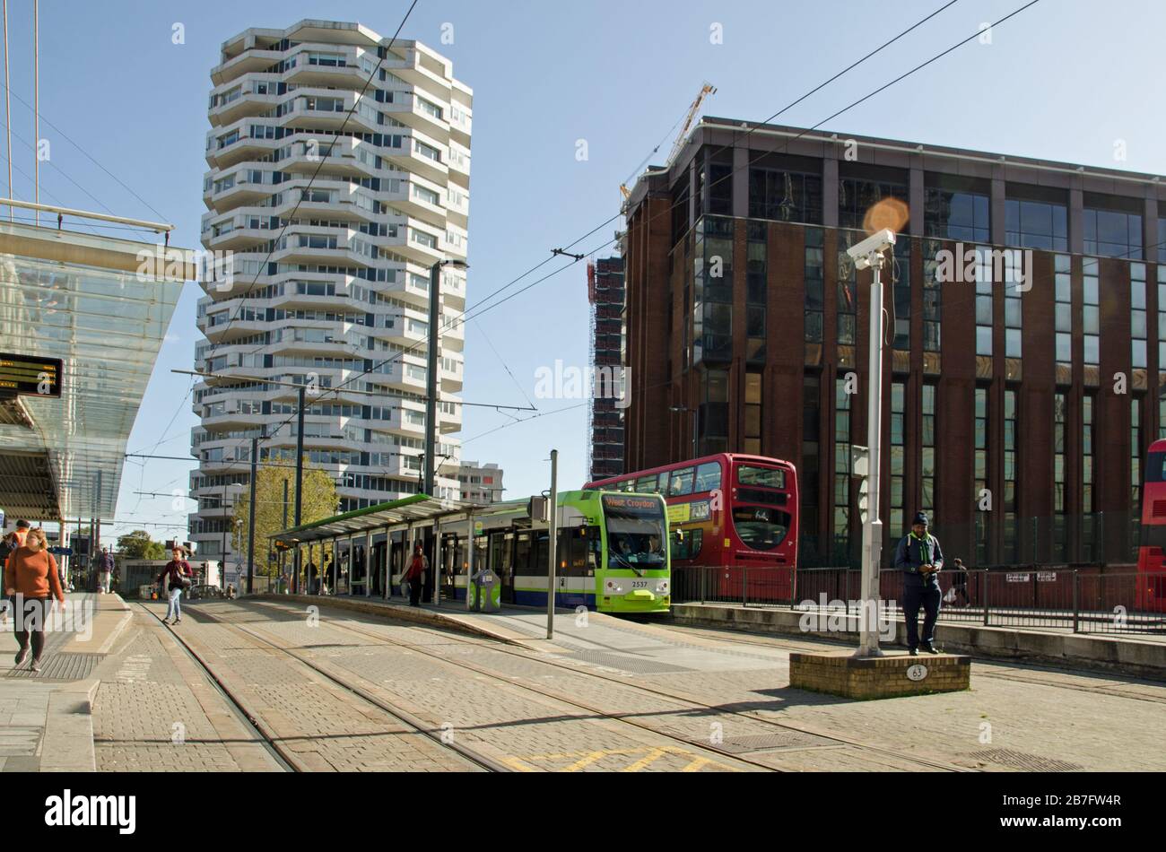 Croydon, UK - October 2, 2019:  Travellers using the various transport offerings outside East Croydon railway station on a sunny autumn day in South L Stock Photo