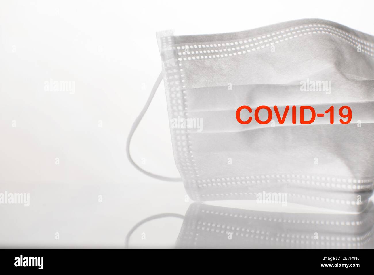 protective white mask for covid-19 virus disease protection medical health science background Stock Photo