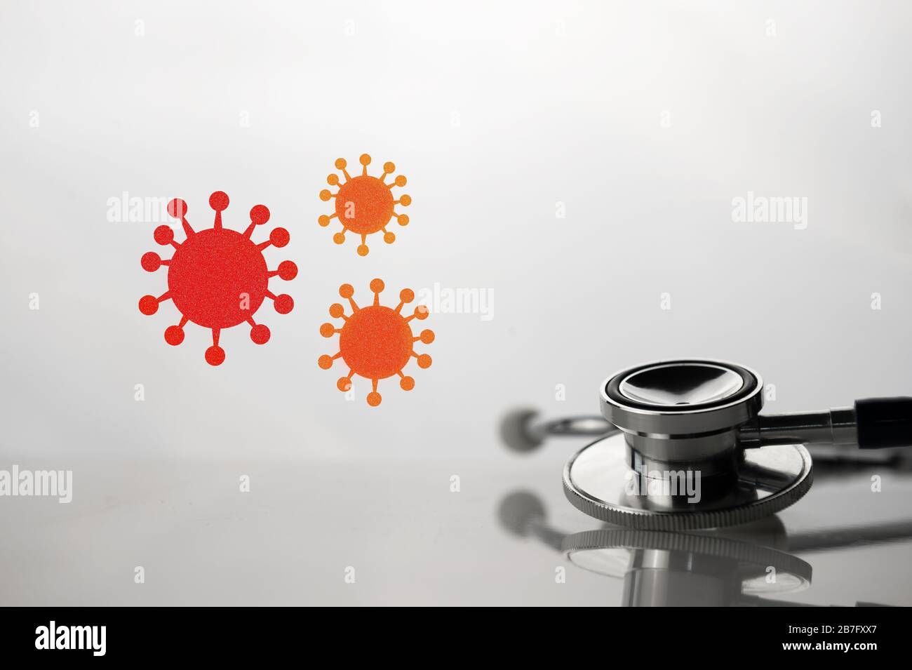 medical stethoscope for health diagnosis for red covid-19 virus inflection in white laboratory background Stock Photo