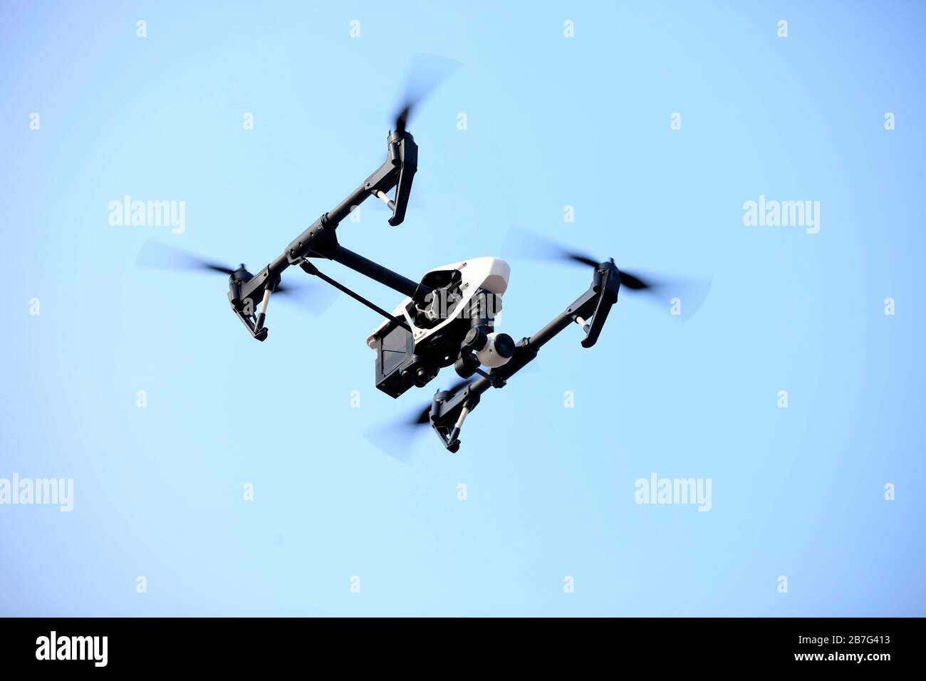 Unmanned aerial vehicle (drone) flying in the sky Stock Photo - Alamy