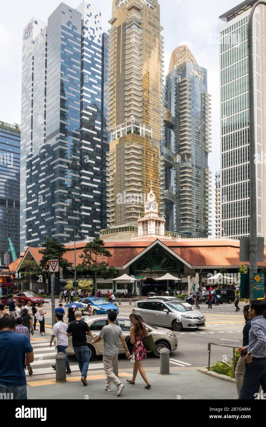 Singapore - July 5th 2019: Lau Pa Sat food court surrounded by skyscrapers. The building is from the Victorian era. Stock Photo