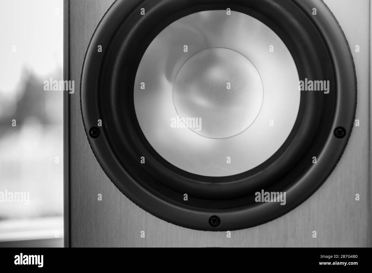 Shiny audio speaker fragment, close-up photo with selective soft focus Stock Photo