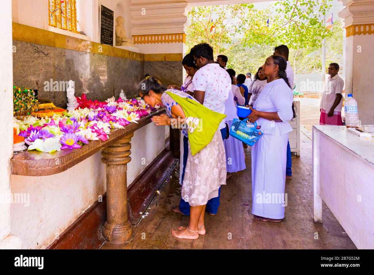 Sri Lanka Anuradhapura Sri Maha Bodhi Tree temple shrine complex original cutting 3rd century BC Princess Sanghamitta worshippers offering floral Stock Photo
