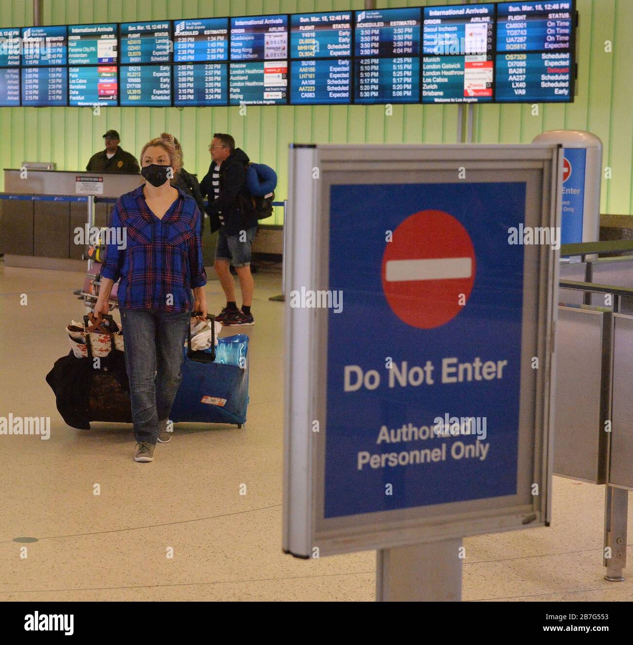 Los Angeles, USA. 15th Mar 2020. International travellers arrive at Los Angeles International Airport on Sunday, March 15, 2020.The stations in place throughout the Bradley Terminal were removed on Sunday, March 15th. There was chaos at international arrivals halls in airports across the United States on Saturday, as President Donald Trump's hastily ordered European travel ban took effect and passengers were forced to endure long waits in crowded spaces. Credit: UPI/Alamy Live News Stock Photo