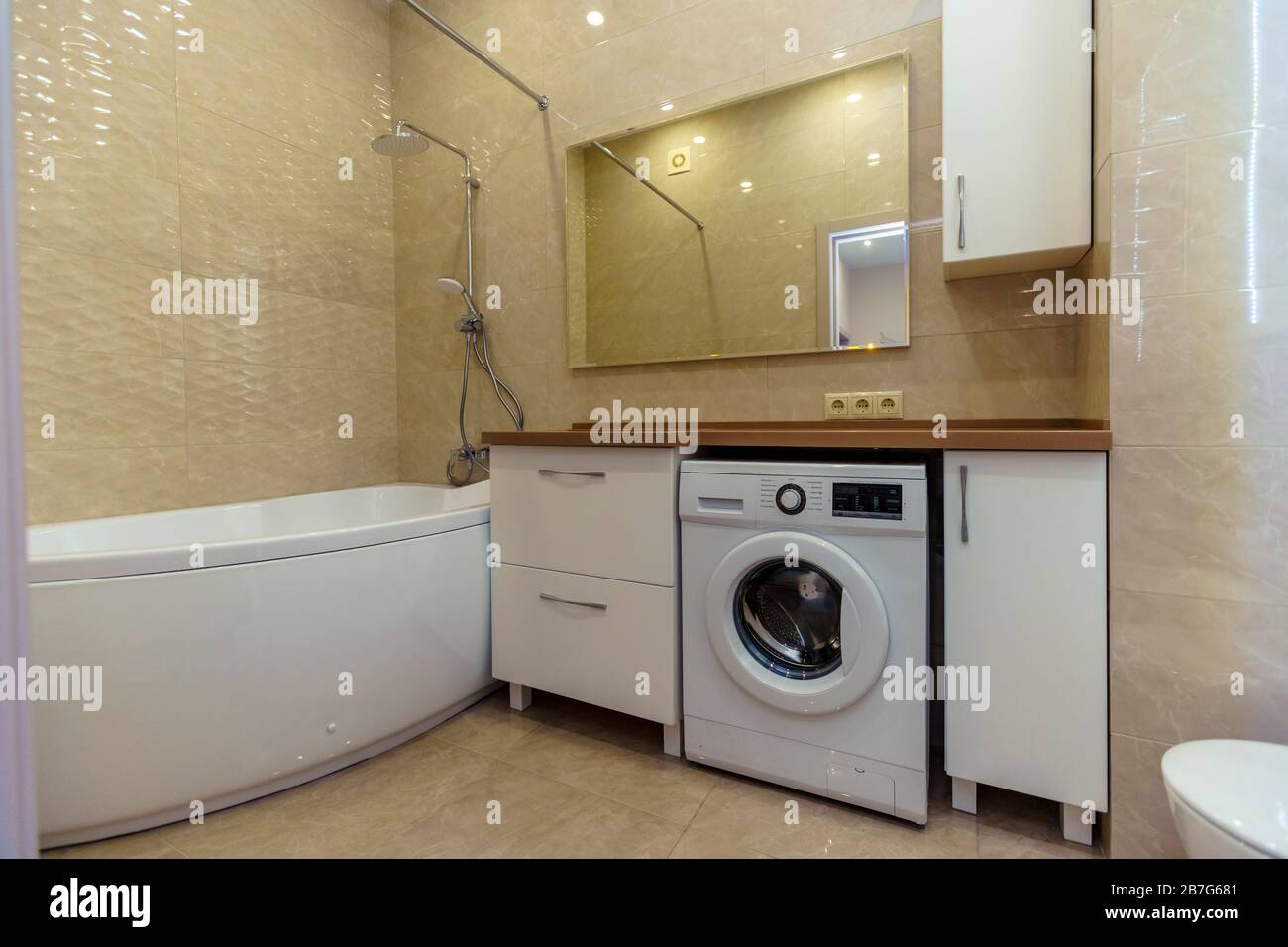 Bathroom With Brown Washbasin And Countertop White Cabinets