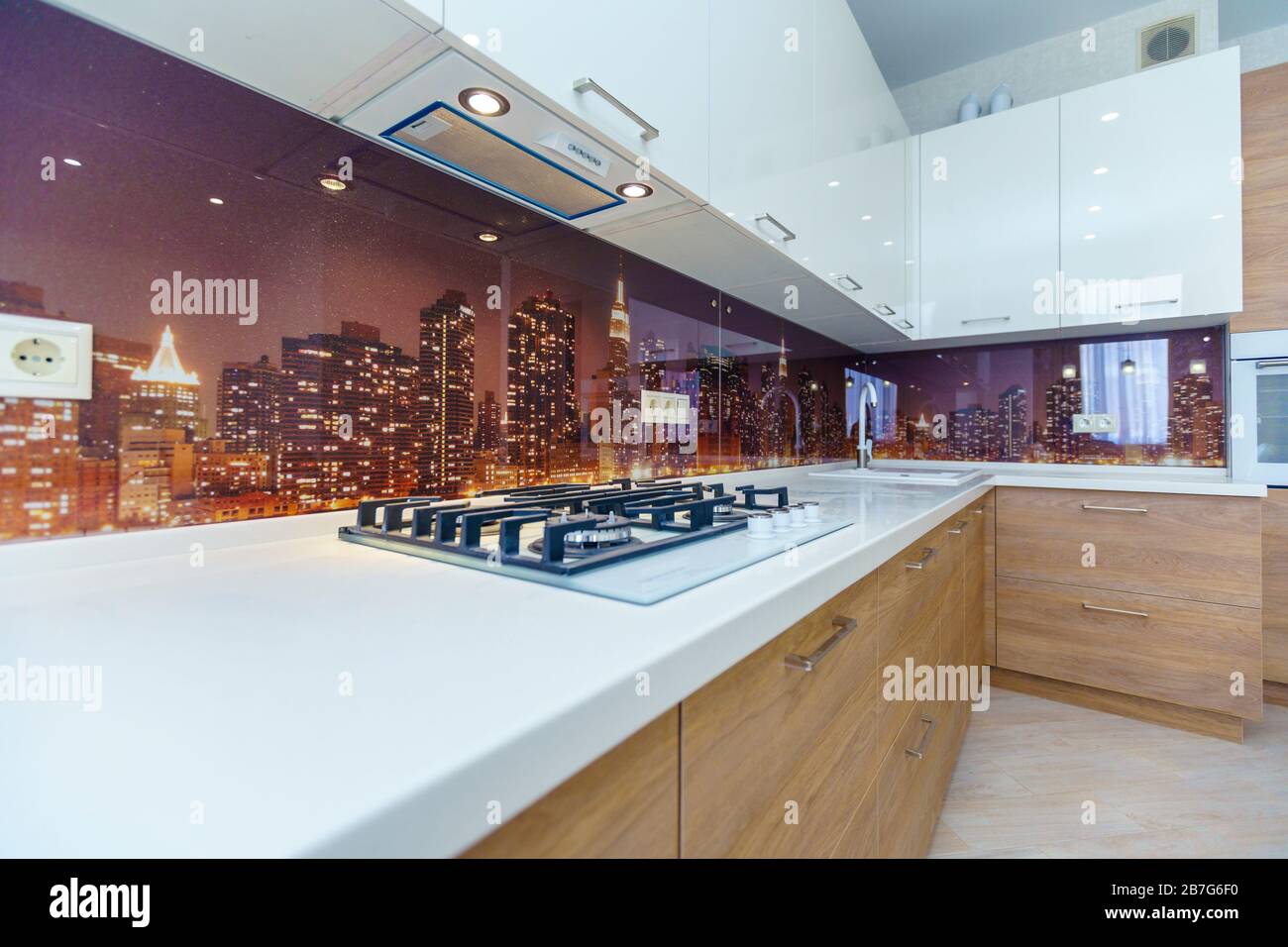 The Kitchen In The Contemporary Style Wooden Lower Drawers White Upper Cabinets Kitchen Appliances Refrigerator Gas Stove Stock Photo Alamy