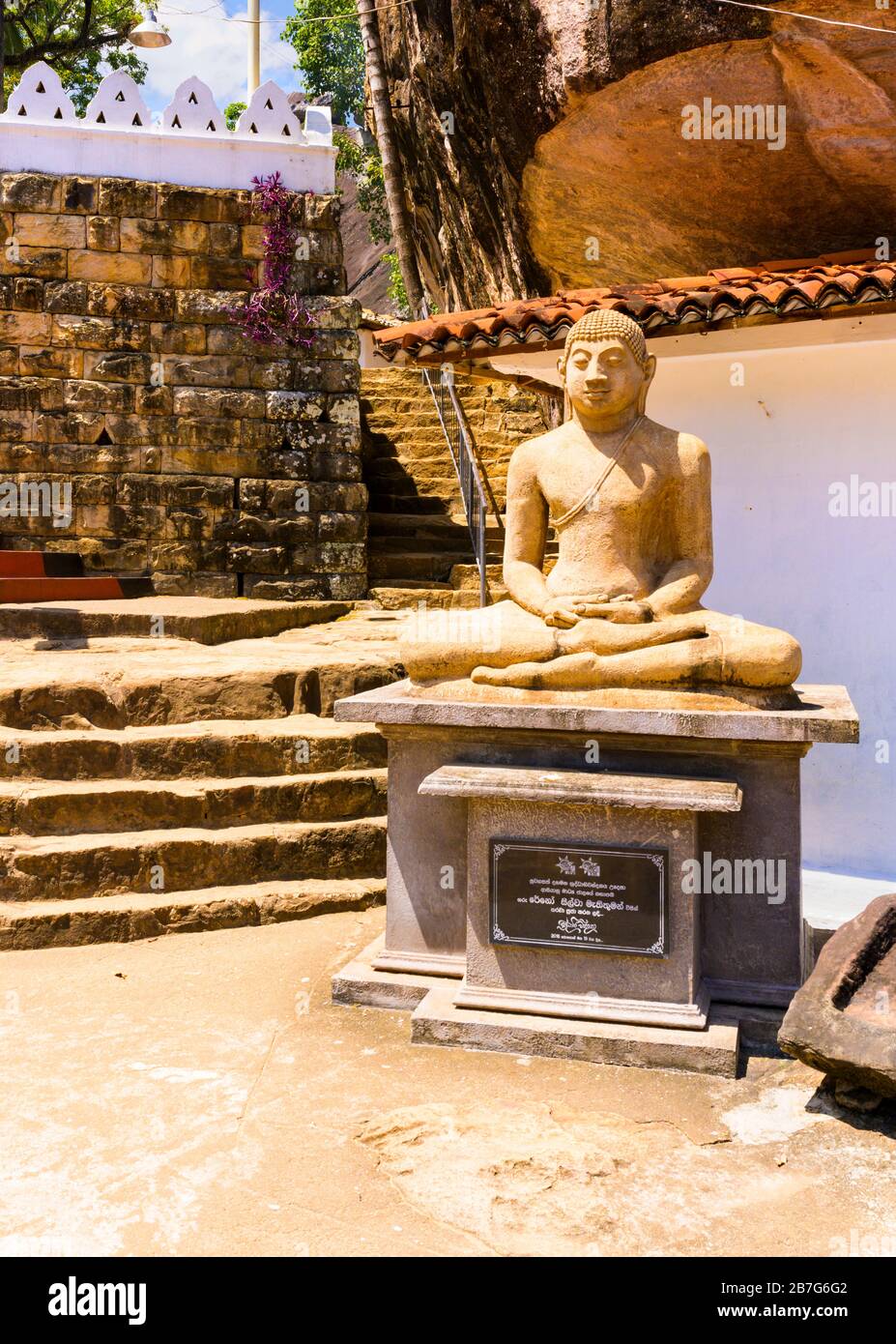 South Asia Sri Lanka ancient Matale Alu Viharya Aluvihare Rock Temple  Buddha statue pedestal steps stairs hill started 90 BC Stock Photo