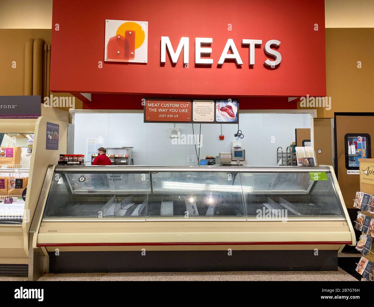 Orlando, FL/USA3/14//20 Empty meat counter shelves at a Publix