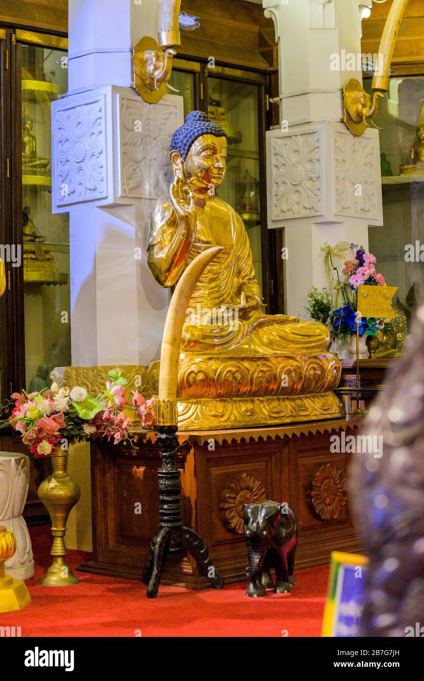 Sri Lanka Kandy Sinhala ancient capital Sri Dalada Maligawa Temple of the Sacred Tooth Relic Buddhist Buddhism interior Buddha gilt statue shrine Stock Photo