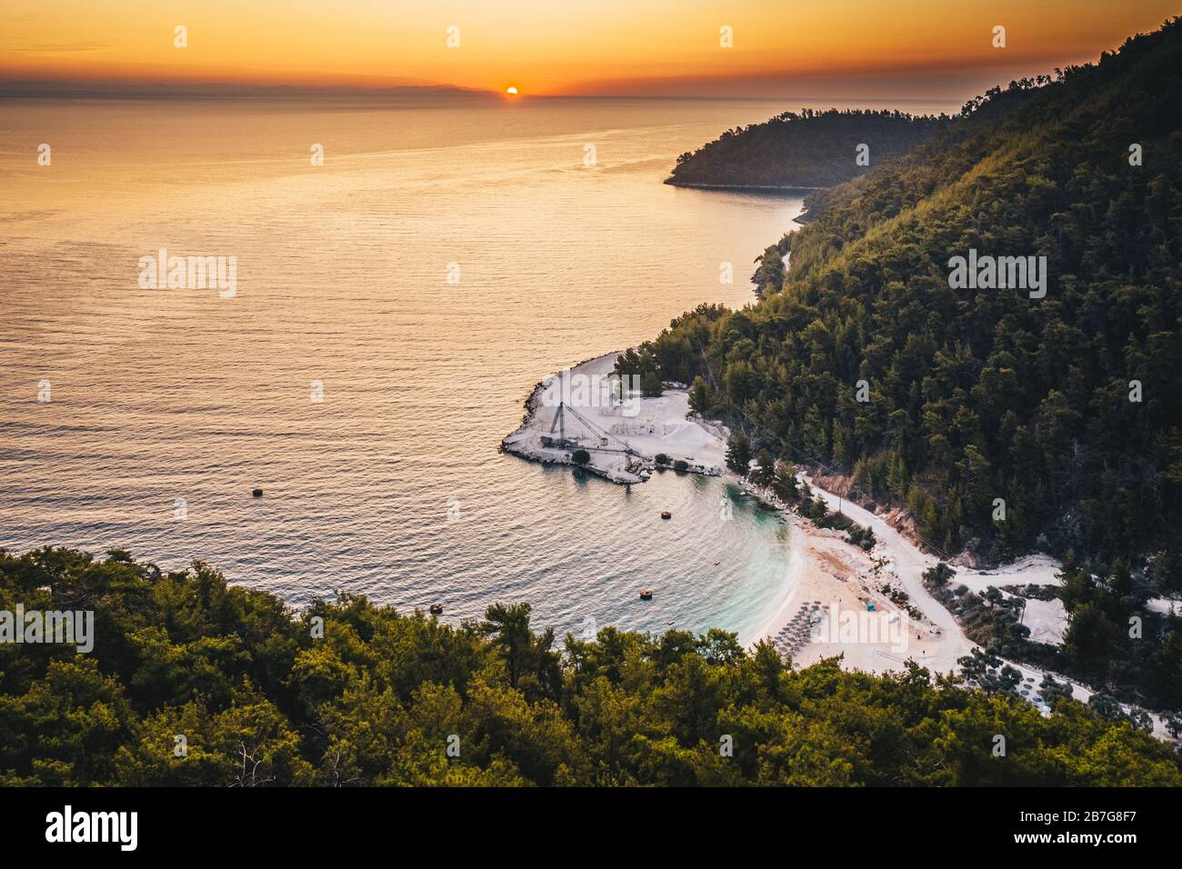 Sunrise over marble beach Porto Vathy in Thassos Island Greece Stock Photo