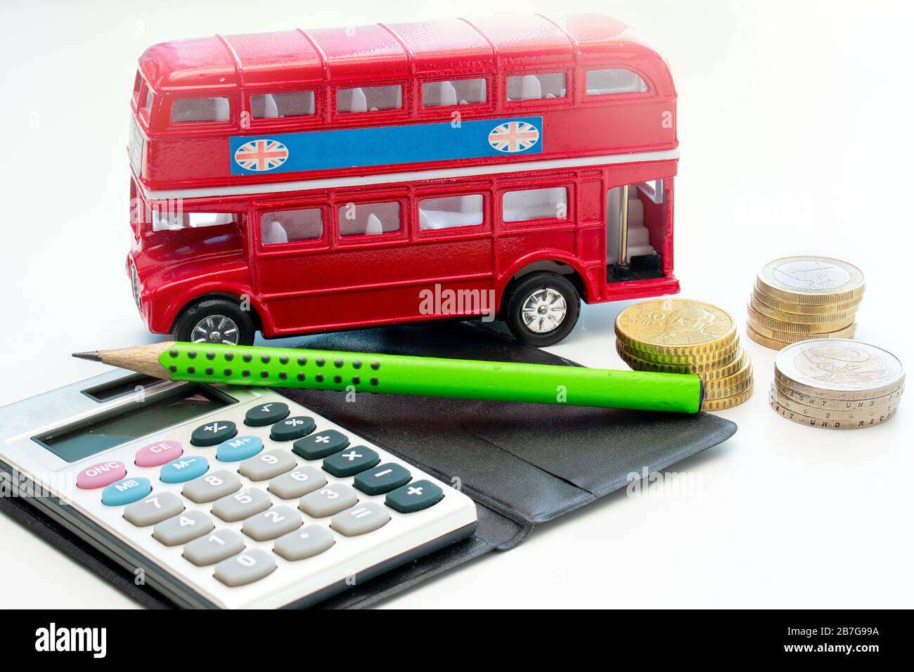 A traditional (toy pickup) two-storey red English bus, behind a ...
