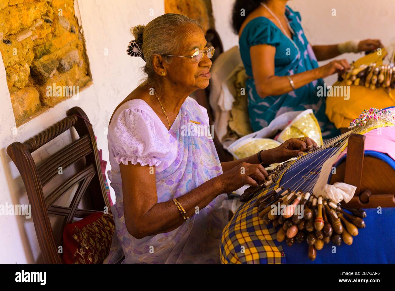 South Asia Sri Lanka Fort Galle colonial town centre old ancient harbour port lacemakers Dentellière tatting cushion bobbins shuttles old grey-haired Stock Photo
