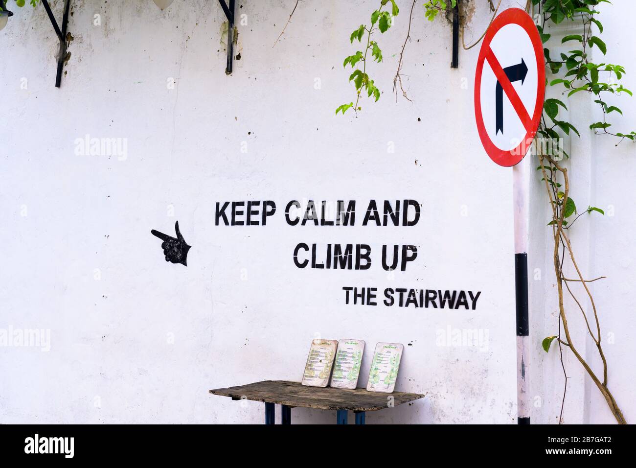 South Asia Sri Lanka Fort Galle colonial town centre ancient harbour menu menus The Staircase international cuisine Keep Calm and Climb Up road sign Stock Photo