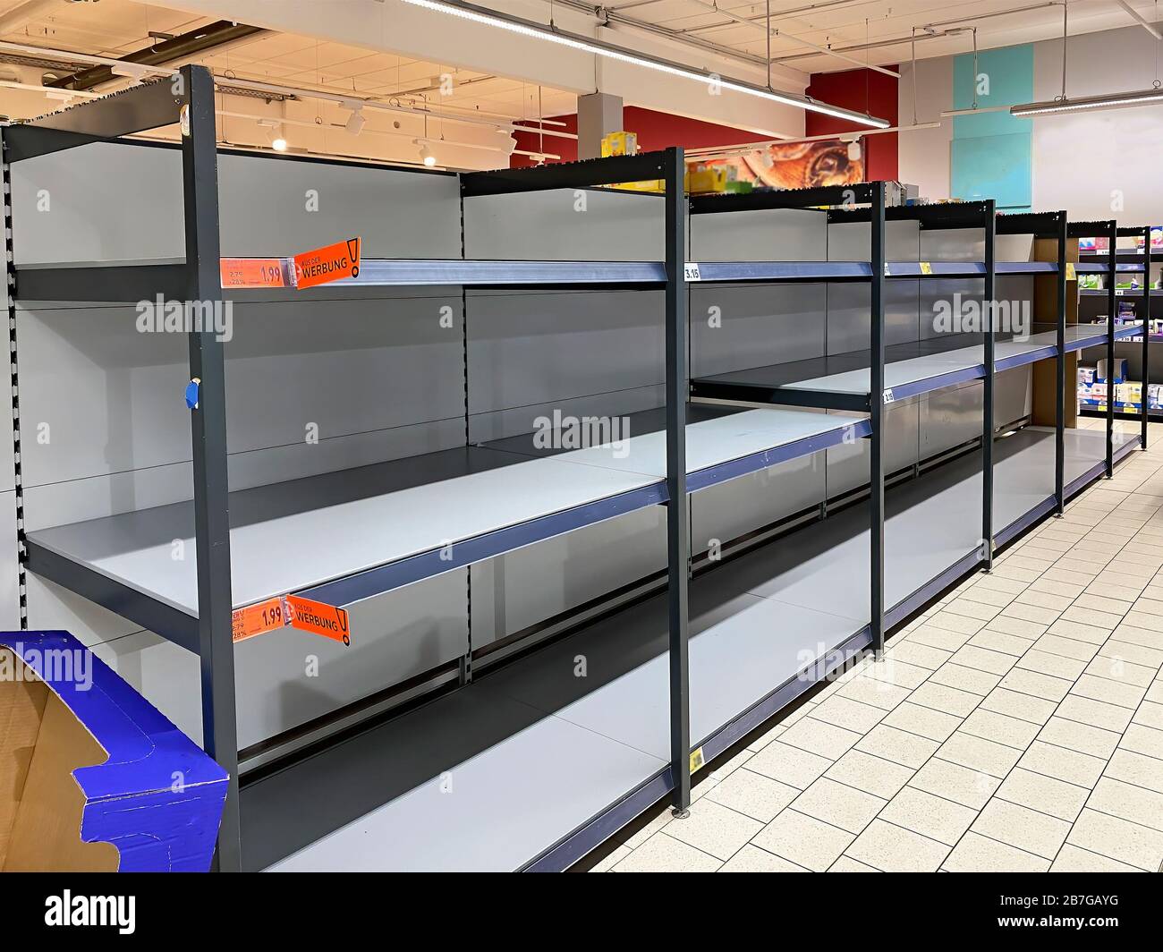 Sold Out Racks in a Supermarket, Coronavirus Crisis Stock Photo