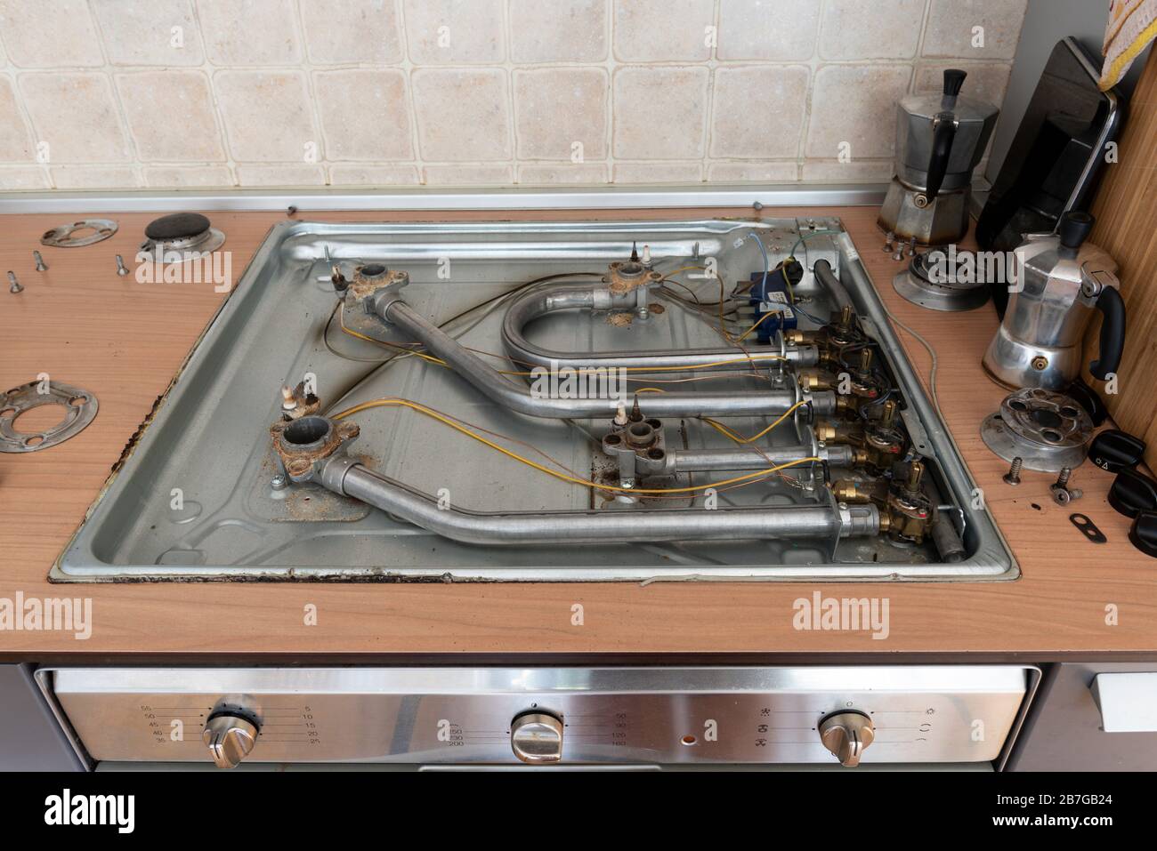 stove maintenance, under the forniture Stock Photo Alamy