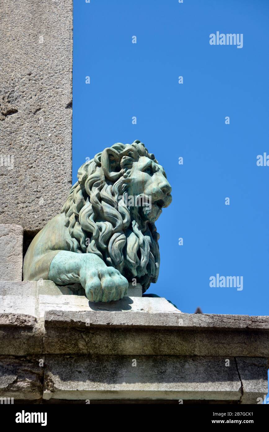 Lion head statue on the obelisk of Arles, a city and commune in the south of France, in the Bouches-du-Rhône department Stock Photo