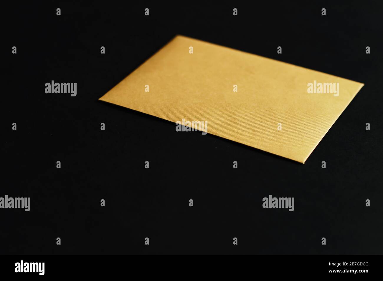 Blank golden paper card on black background, premium business and ...
