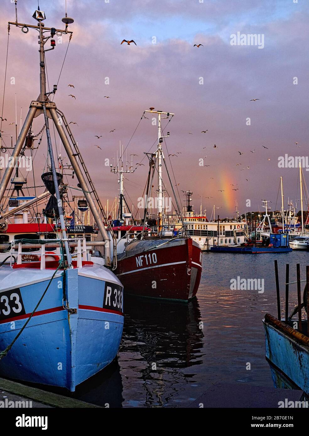 fishing wessels with rainbow Stock Photo