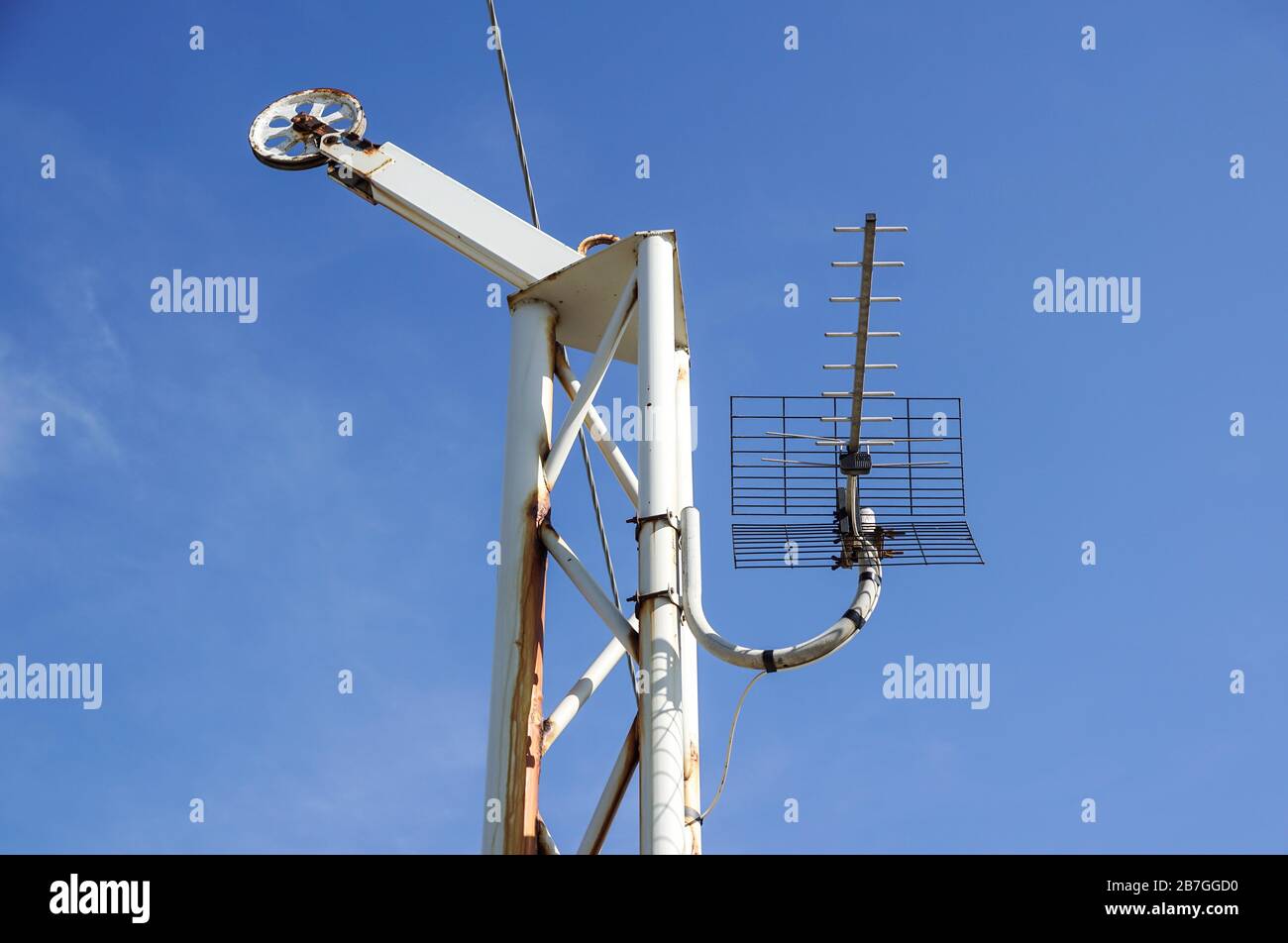 Steel pulley wheel with three steel cables looping around the pulley