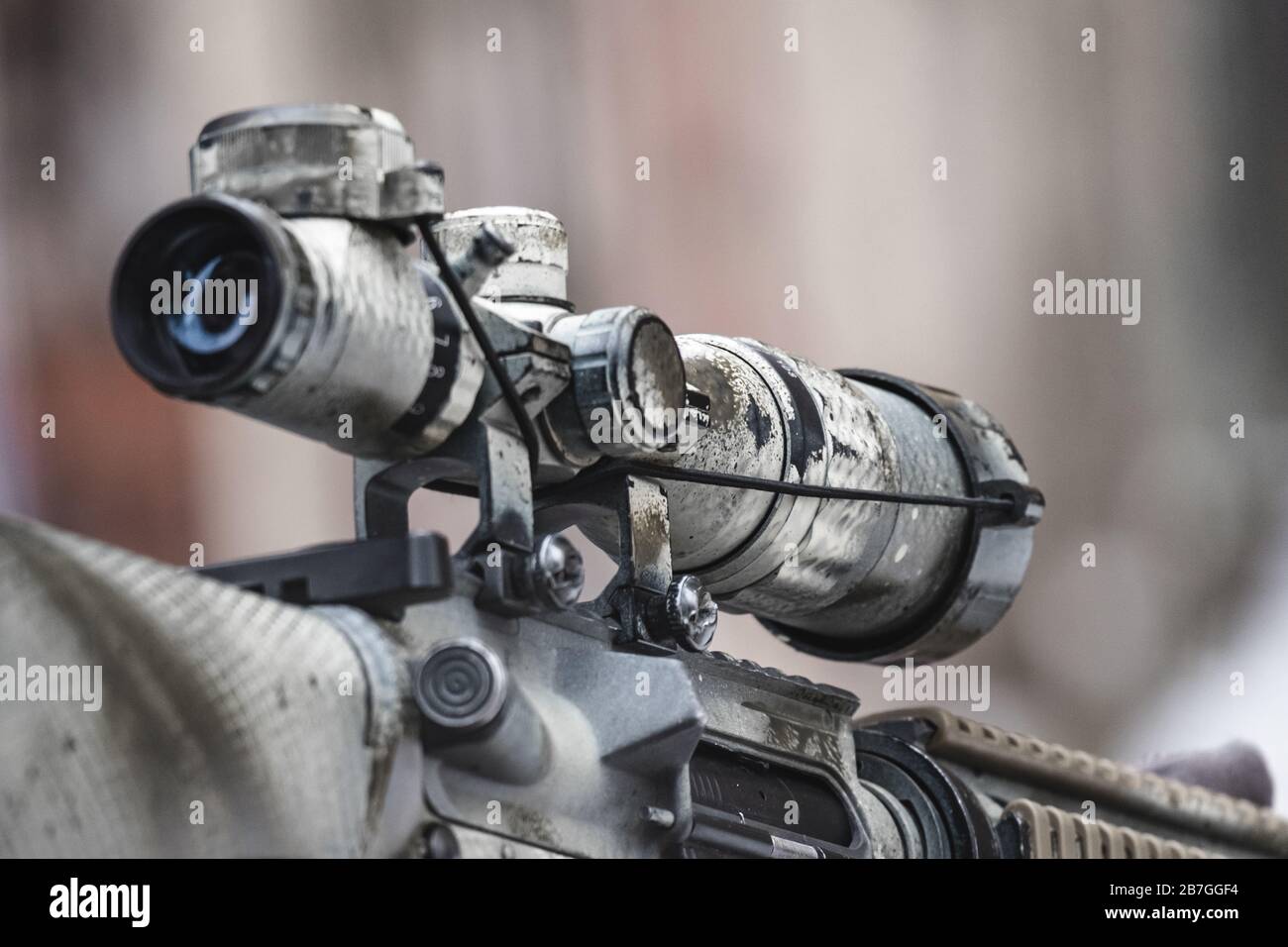 Rifle scope on the street with blurry background. Close up Stock Photo