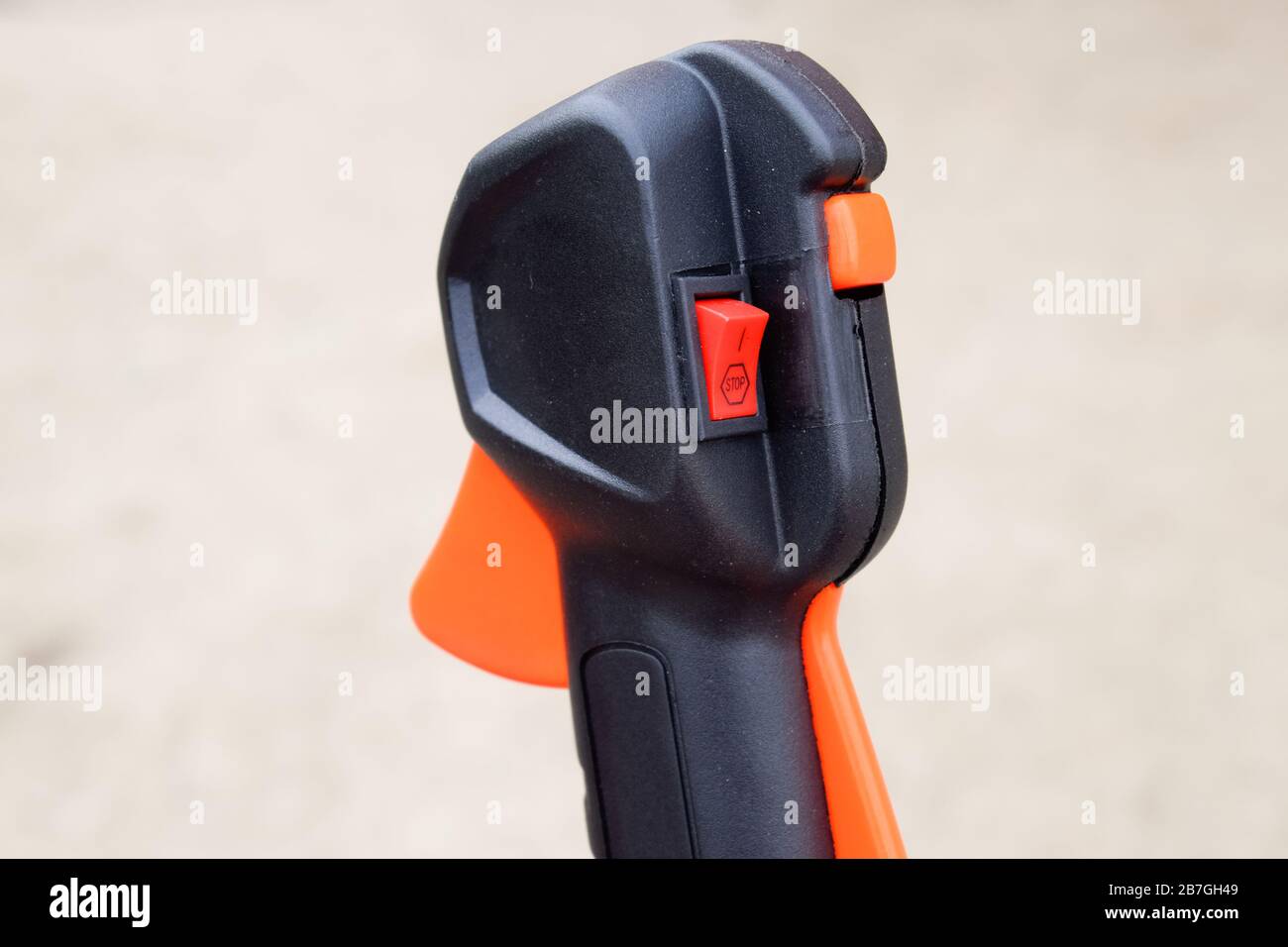 Knob with trimmer controls. Gas trimmer, equipment controls. Trimer gascosis with a leaf for mowing grass and shrubs. Stock Photo