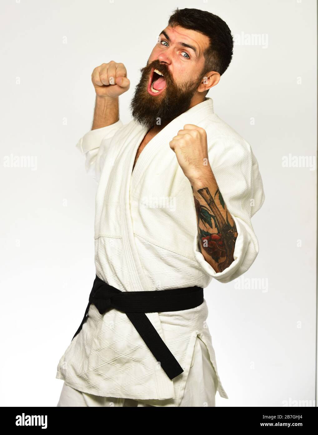 Karate fighter isolated on white background. Athlete kung fu master