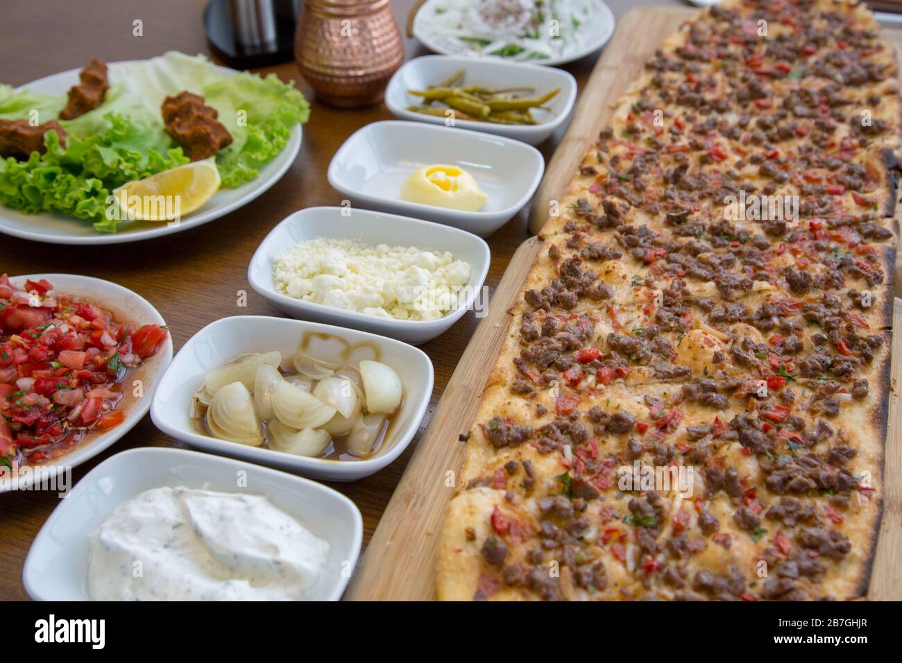 Traditional Turkish Cuisine; pide with cubed meat / kusbasili pide ...