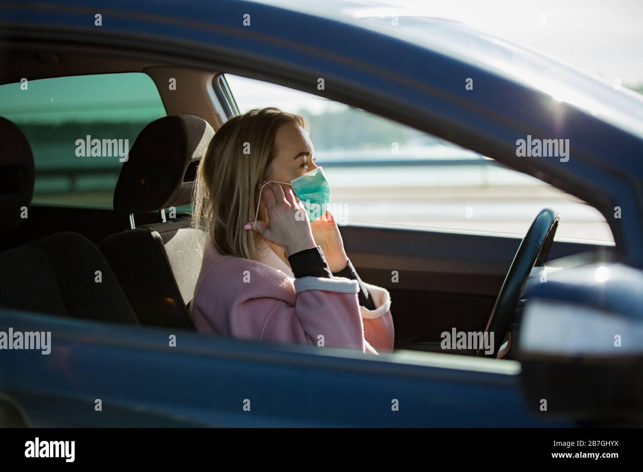 Woman breathing mask car hires stock photography and images Alamy