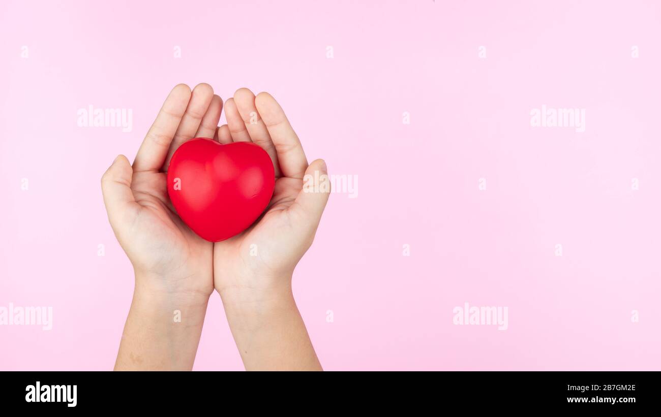 world health day, child hands holding red heart, healthcare, love and ...