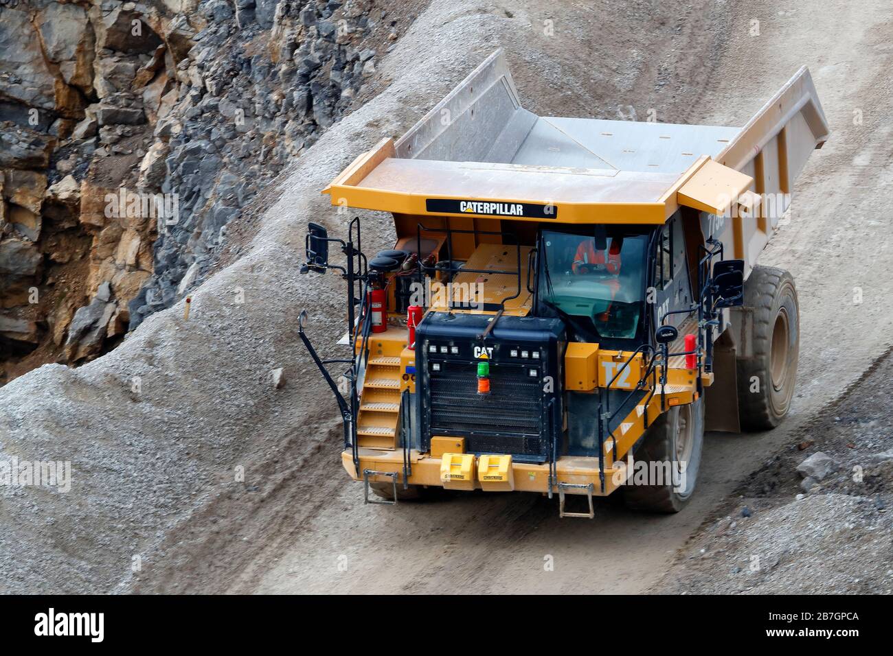 A Caterpillar 775G truck working in Coldstones Quarry, Greenhow Hill, Niddedale in North Yorkshire, the quarry is owned and operated by Hansons. Stock Photo