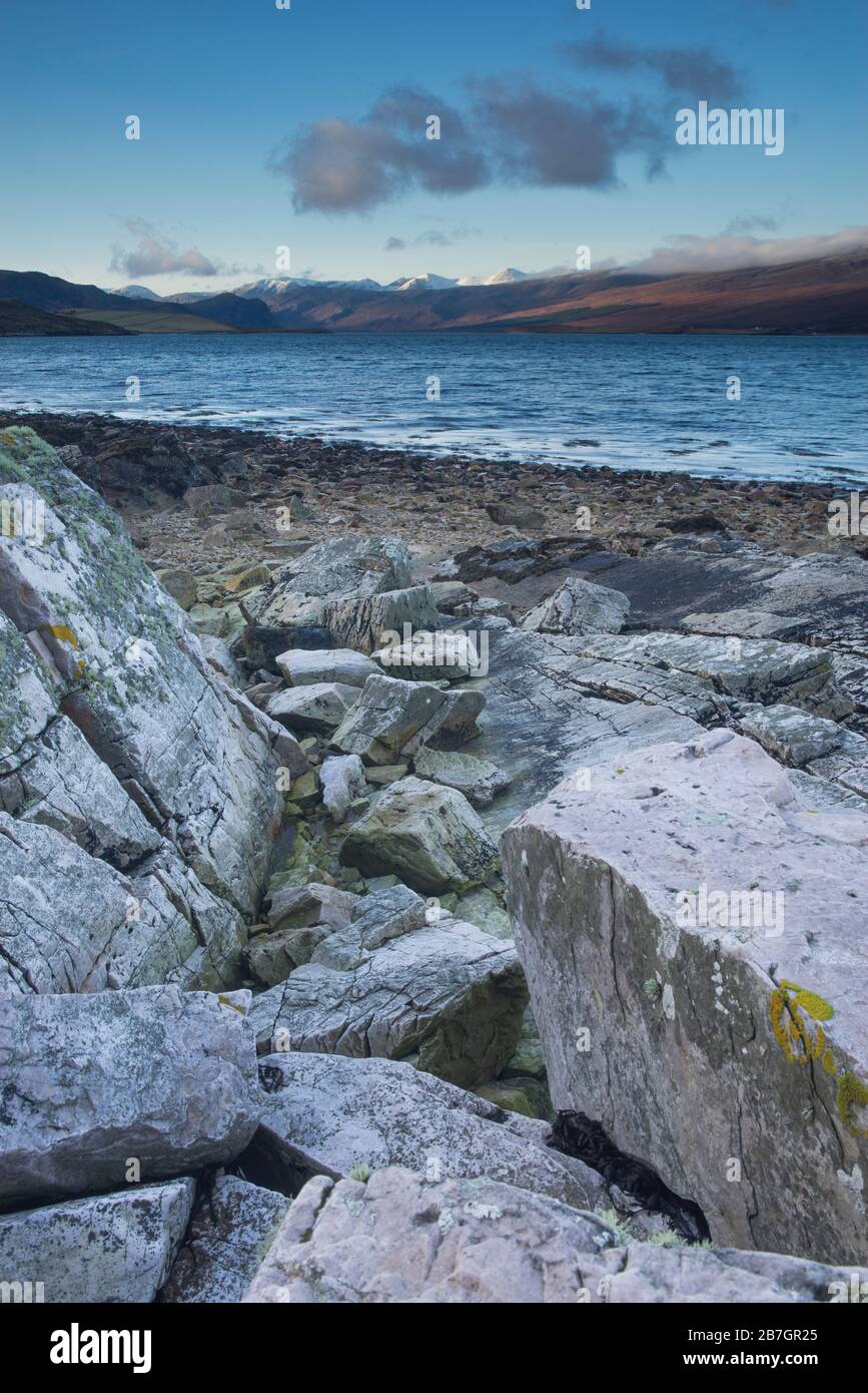 Limestone boulders and wave cut rocks on the shores of Loch Eriboll, Sutherland, Scotland, UK Stock Photo