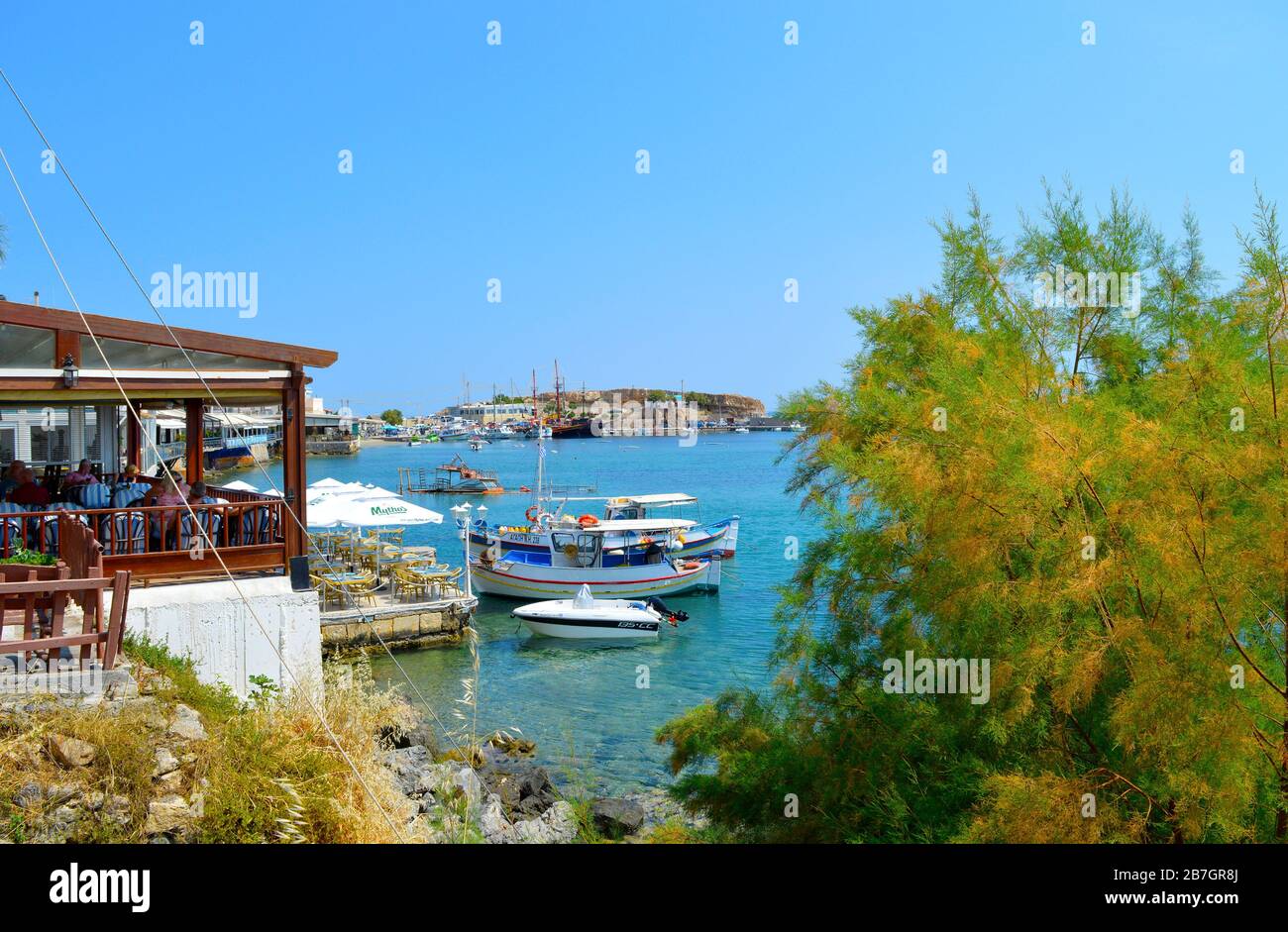 Boats in Hersonissos harbour a popular tourist attraction in the Greek