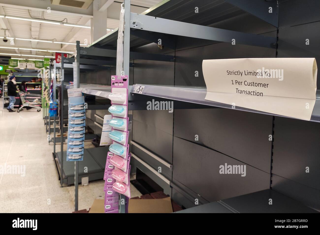 Tipton, West Midlands UK. 16th March 2020. ASDA are limiting customers to one pack of toilet roll per customer in the ASDA Supercentre in Great Bridge, Tipton due to panic buying from those concerned over Coronavirus. This however still did not stop the shelves from being cleared of stock. One out of stock label noted that the last delivery of Cushelle Toilet Roll was made on the 9th of March, even though retailers continue to reassure there is sufficent stock. Sam Holiday/Alamy Live News Stock Photo